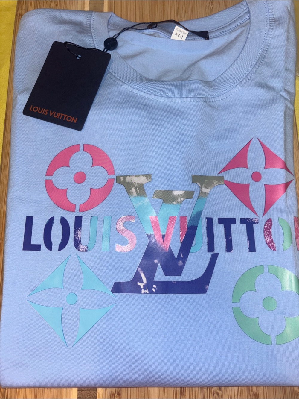 Woman’s ' Light Blue Logo Graphic Tee Red 👇